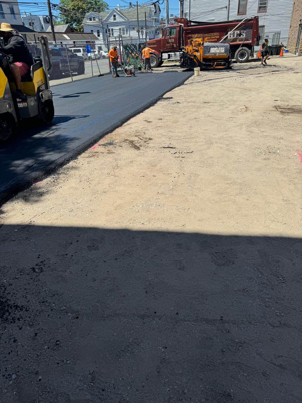 Asphalt driveway paving and rolling