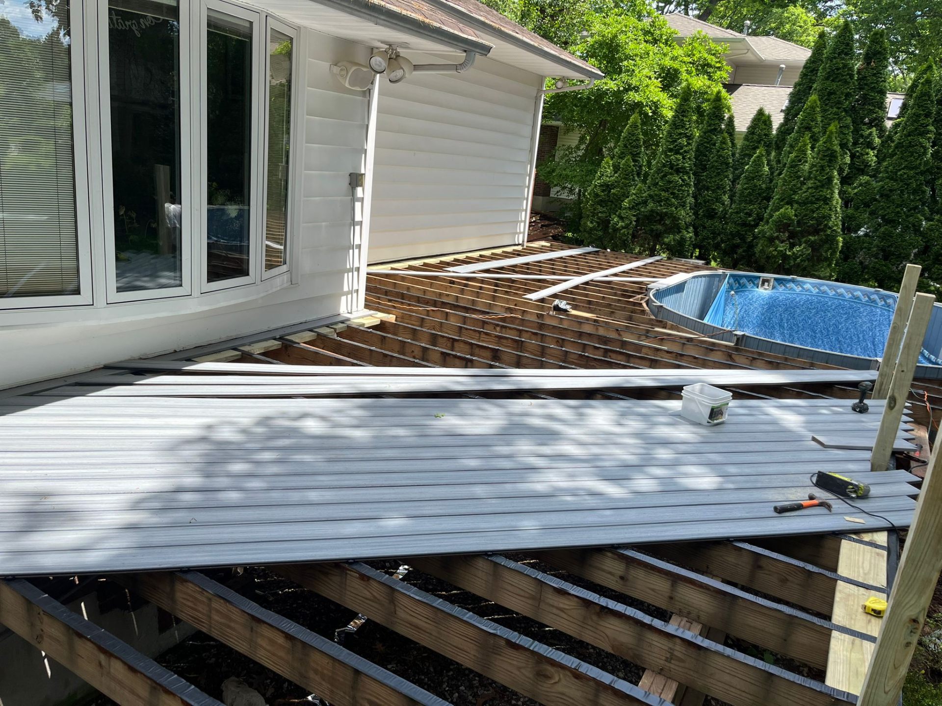 Gray composite decking installation in progress